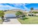 Single story home with two car garage and manicured lawn at 1717 Nuremberg Blvd, Punta Gorda, FL 33983