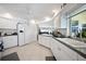 Modern kitchen boasts white cabinetry, stainless steel appliances, and a large refrigerator at 1717 Nuremberg Blvd, Punta Gorda, FL 33983