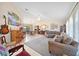 Bright and airy living room with a sectional sofa and piano at 1717 Nuremberg Blvd, Punta Gorda, FL 33983