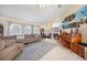 Open concept living area with sectional sofa and high ceilings at 1717 Nuremberg Blvd, Punta Gorda, FL 33983