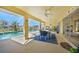Spacious pool area with a screened enclosure and patio furniture at 1717 Nuremberg Blvd, Punta Gorda, FL 33983