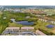 Community features a lake, lush landscaping, and resort-style amenities at 175 Kings Hwy # 528, Punta Gorda, FL 33983