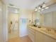 Bathroom with vanity, toilet, and access to shower at 175 Kings Hwy # 528, Punta Gorda, FL 33983