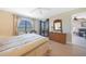 Bedroom with wicker dresser and private balcony access at 175 Kings Hwy # 528, Punta Gorda, FL 33983