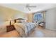 Cozy bedroom with wicker furniture and large window at 175 Kings Hwy # 528, Punta Gorda, FL 33983