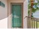 Condo building entryway with teal door and screen at 175 Kings Hwy # 528, Punta Gorda, FL 33983