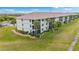 Building exterior showcases well-maintained landscaping and architecture at 175 Kings Hwy # 528, Punta Gorda, FL 33983