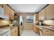 Kitchen boasts wood cabinets, stainless steel appliances, and a workspace at 175 Kings Hwy # 528, Punta Gorda, FL 33983