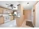 Bright kitchen with wood cabinets, white appliances, and breakfast bar at 175 Kings Hwy # 528, Punta Gorda, FL 33983
