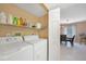 Convenient laundry room with washer, dryer and access to dining area at 175 Kings Hwy # 528, Punta Gorda, FL 33983