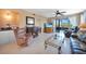 Spacious living room with fireplace and access to balcony at 175 Kings Hwy # 528, Punta Gorda, FL 33983