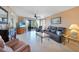 Comfortable living room featuring leather sofa and balcony view at 175 Kings Hwy # 528, Punta Gorda, FL 33983