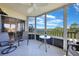 Enjoyable screened balcony with seating and serene lake view at 175 Kings Hwy # 528, Punta Gorda, FL 33983