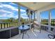 Spacious screened balcony with lake and partial golf course view at 175 Kings Hwy # 528, Punta Gorda, FL 33983