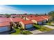Community of tan houses with red roofs at 1780 Deborah Dr # 15, Punta Gorda, FL 33950