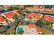 Aerial view of community pool and villas near canal at 1780 Deborah Dr # 15, Punta Gorda, FL 33950