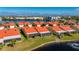 Aerial view of waterfront community with orange roofs and lush landscaping at 1780 Deborah Dr # 15, Punta Gorda, FL 33950