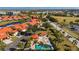 Aerial view of community pool, villas, and surrounding landscape at 1780 Deborah Dr # 15, Punta Gorda, FL 33950