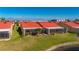 Aerial view of canal-front villas with orange tile roofs and lush landscaping at 1780 Deborah Dr # 15, Punta Gorda, FL 33950