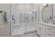 Bathroom with walk-in shower, modern vanity, and elegant tile at 1780 Deborah Dr # 15, Punta Gorda, FL 33950