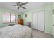 Bedroom with queen bed, ceiling fan, and large closet at 1780 Deborah Dr # 15, Punta Gorda, FL 33950