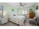 Bright bedroom with a ceiling fan, queen-size bed, and ample closet space at 1780 Deborah Dr # 15, Punta Gorda, FL 33950