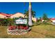 Paradise Garden Villas community sign with festive decorations at 1780 Deborah Dr # 15, Punta Gorda, FL 33950
