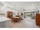 Open concept dining room and living area with hardwood floors and views to the lanai at 1780 Deborah Dr # 15, Punta Gorda, FL 33950