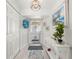 Bright and airy entryway with white walls and wood-look floors at 1780 Deborah Dr # 15, Punta Gorda, FL 33950
