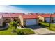 Tan house with red roof and attached garage at 1780 Deborah Dr # 15, Punta Gorda, FL 33950