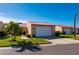 Tan house with red tile roof, white garage door, and palm trees at 1780 Deborah Dr # 15, Punta Gorda, FL 33950