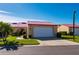 Tan house with red tile roof and white garage door at 1780 Deborah Dr # 15, Punta Gorda, FL 33950