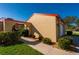 Tan stucco house with red tile roof and walkway at 1780 Deborah Dr # 15, Punta Gorda, FL 33950