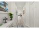 Light hallway with wood-look floors, leading to other rooms at 1780 Deborah Dr # 15, Punta Gorda, FL 33950