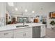Modern kitchen with island, stainless steel appliances and breakfast bar at 1780 Deborah Dr # 15, Punta Gorda, FL 33950