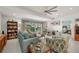 Spacious living room with comfortable seating, wood flooring and access to the lanai at 1780 Deborah Dr # 15, Punta Gorda, FL 33950