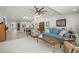 Open living area with hardwood floors, and view to kitchen and dining area at 1780 Deborah Dr # 15, Punta Gorda, FL 33950