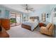 Main bedroom with light and bright paint, and access to the patio at 1780 Deborah Dr # 15, Punta Gorda, FL 33950