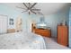 Main bedroom with ensuite bathroom, and view into the living room at 1780 Deborah Dr # 15, Punta Gorda, FL 33950