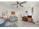 Home office with seating area, built-in shelving, and a view to another room at 1780 Deborah Dr # 15, Punta Gorda, FL 33950