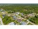 Aerial view of single-Gathering home with pool and fenced backyard at 18147 Cadillac Ave, Port Charlotte, FL 33948