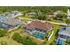 Aerial view of single-Gathering home with pool and fenced backyard at 18147 Cadillac Ave, Port Charlotte, FL 33948