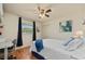 Bright bedroom with a queen bed, hardwood floors, and a built-in desk at 18147 Cadillac Ave, Port Charlotte, FL 33948
