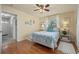 Bedroom with a queen bed, hardwood floors, and access to hallway at 18147 Cadillac Ave, Port Charlotte, FL 33948