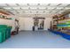 Spacious two-car garage with extra storage shelving and flooring at 18147 Cadillac Ave, Port Charlotte, FL 33948