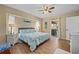 King bedroom with sliding door to patio and coastal decor at 18147 Cadillac Ave, Port Charlotte, FL 33948