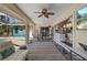 Spacious covered patio with seating area, adjacent to kitchen and pool at 18147 Cadillac Ave, Port Charlotte, FL 33948