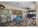 Relaxing patio dining area with view of the outdoor bar and lounge at 18147 Cadillac Ave, Port Charlotte, FL 33948