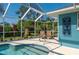 Screened pool and patio with lush landscaping at 18147 Cadillac Ave, Port Charlotte, FL 33948