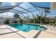 Inviting screened pool with ample deck space at 18147 Cadillac Ave, Port Charlotte, FL 33948
